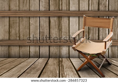 Director\'s chair on the wood background