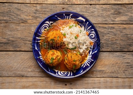 Meatballs with chipotle red sauce and rice. Traditional mexican food Foto stock © 