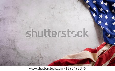 Happy presidents day concept with flag of the United States on old stone background.