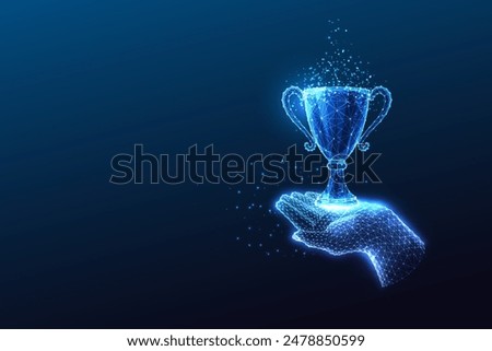 Achievement, business or sport success futuristic concept with hand holding trophy cup on dark blue background. Glowing low polygonal style. Modern abstract connection design vector illustration.