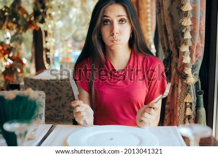 Stressed Woman Having a Pill Before the Meal in a Restaurant. Unhealthy dieting with extreme measures of being in a caloric deficit
 Foto stock © 
