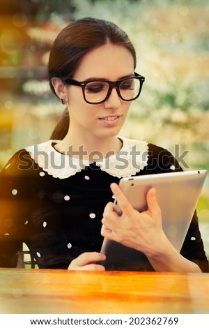 Young Woman with Glasses and Tablet - Beautiful woman with glasses holds a tablet computer