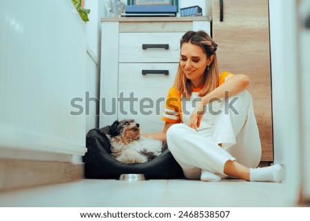 Image, Stock Photo Woman caressing dog at home
