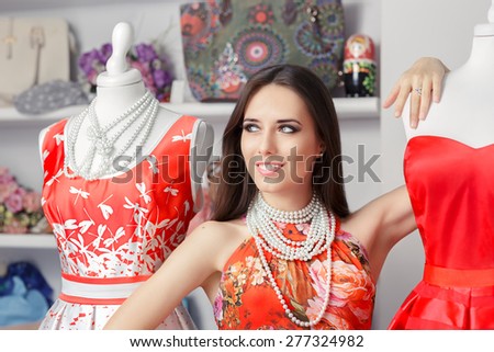 Woman in Red Floral Dress in Fashion Store - Portrait of girl in a clothes shop among red summer dresses