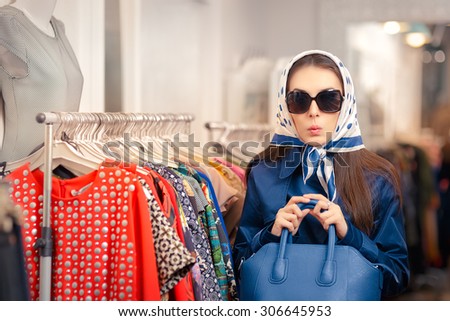 Curious Girl in Blue Trench Coat and Sunglasses Shopping - Surprised retro young woman in a raincoat in a clothing store