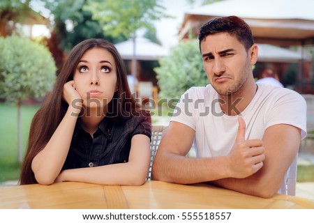 Woman and Man on a Boring Bad Date at the Restaurant - Girlfriend and boyfriend not getting along anymore Сток-фото © 