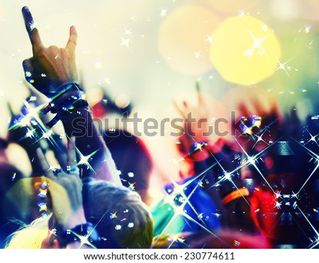 concert crowd in front  with hands up with rock-n-roll sign Foto stock © 