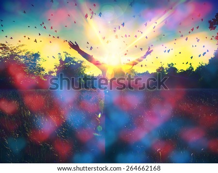 Young girl spreading hands,freedom concept,colorful heart bokeh background,love and emotions,woman happiness