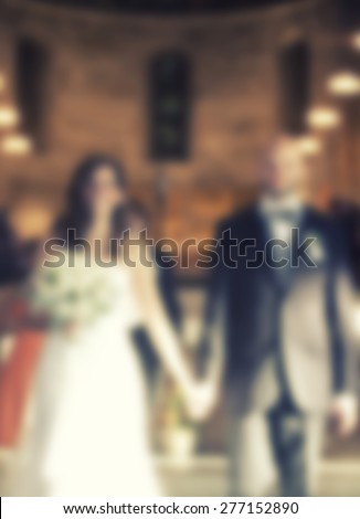 WEDDING COUPLE ,WALKING INTO CHURCH ON WEDDING CEREMONY