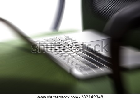 lap top computer in the office chair,blurred background