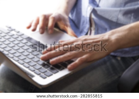 business woman hands busy using laptop at office desk,woman typing on the laptop ,office space ,blurred office background