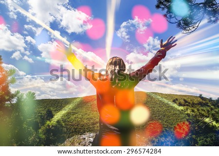 man with hands wide open in front of beautiful landscape,with sun rays ,happy and joy ,enjoying life,Successful Man