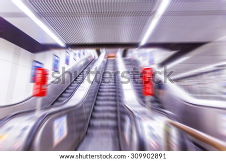 people on the escalator in metro station