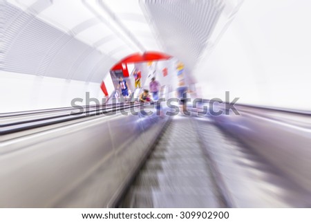 people on the escalator in metro station