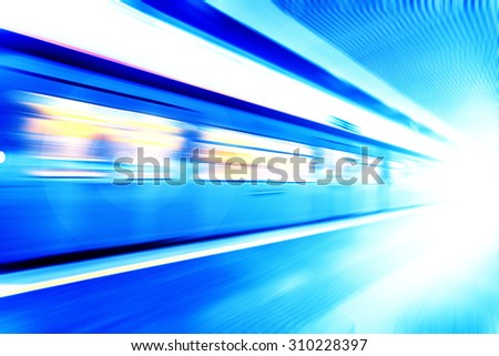 fast train traveling at high speed through a station