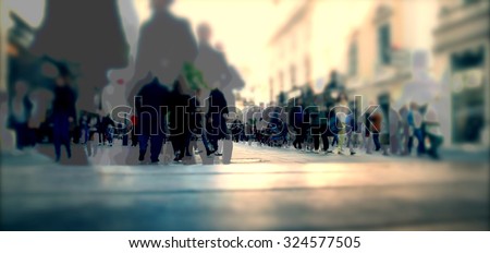 Silhouette of people walking on the street of big city shopping day, big crowd of people walking