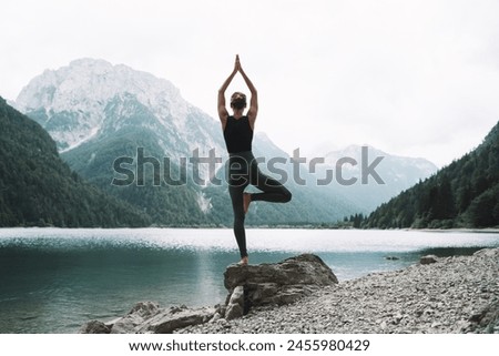 Similar – Image, Stock Photo Woman doing yoga in Supported Headstand pose