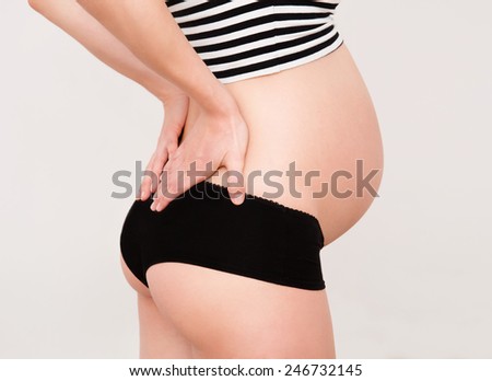 Beauty pregnant woman suffering lower back pain