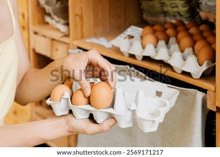 Similar – Image, Stock Photo organic eggs in egg box on white marble kitchen table