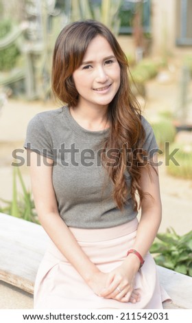 portrait asia young woman smile on summer outdoor desert garden