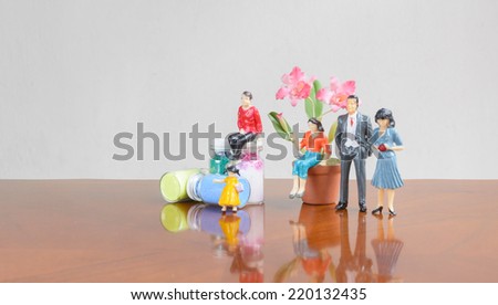 miniature family people with flower deco concept family together