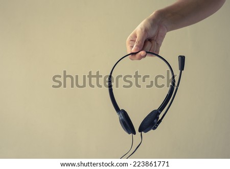 woman Hands Holding Headphones with retro filter