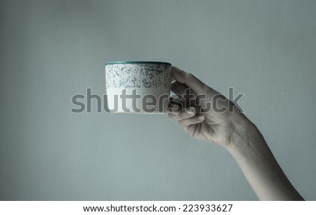 woman hand hold Cup of coffee hot drink with retro filter