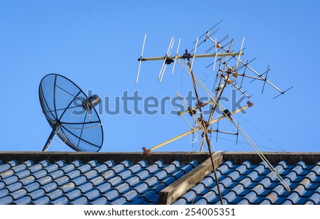 Satellite Dishes with television radar metal on roof for telecommunication