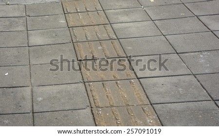 Blind people\'s track. old street road pattern background