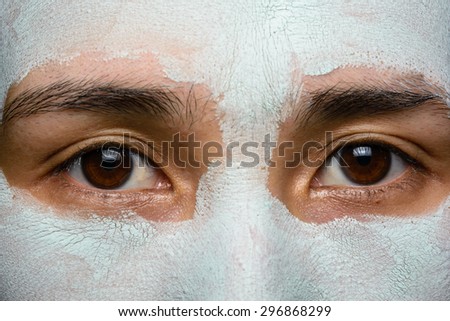 close up face asia girl treatment blue facial mask
