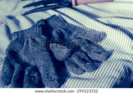 Cotton gloves gardening with retro filter on fabric pattern