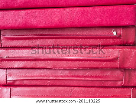 pile of red leather cushion texture background