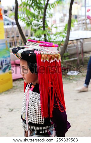 Chiangmai, Thailand - December 18, 2014: thailand hill tribe girl with traditional northern tribe costume in royal project fair at Chiangmai university.