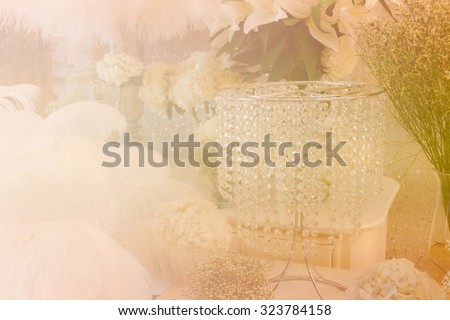 bunch of white hydrangea, feather and crystal ornament with soft focus and color filter for romantic and wedding concept