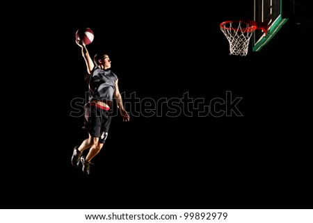 Basketball jump isolated on black background