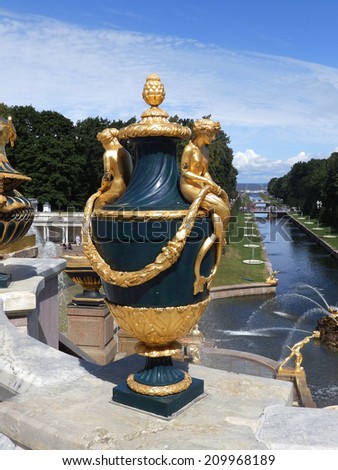ST PETERSBURG, RUSSIA -  JULY 19, 2013: Grand Cascade and Sea Channel in Perterhof Palace. The Peterhof palace included in the UNESCO\'s World Heritage List