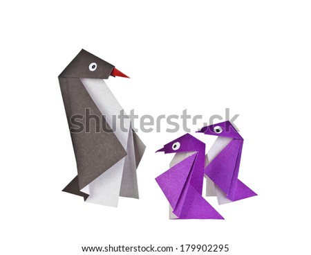 Origami. Paper figures of penguins. Traditional Japanese art folding of figures from paper