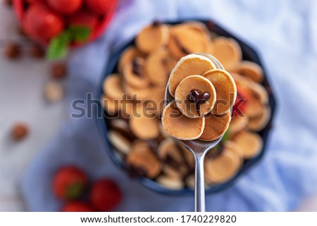 Similar – Image, Stock Photo Tiny cereal pancakes and strawberries