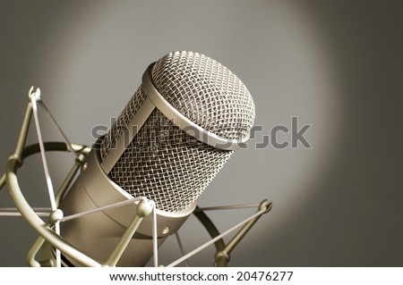 Microphone in studio on a light background.