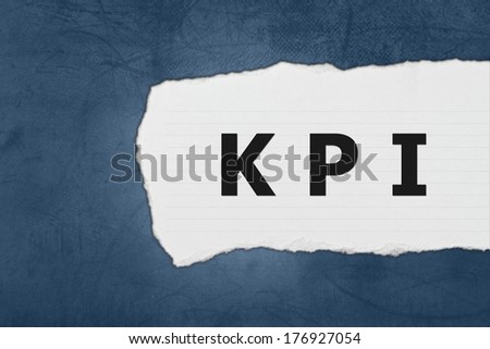 KPI or Key Performance indicator with white paper tears on blue texture