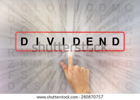 hand clicking dividend on word search puzzle