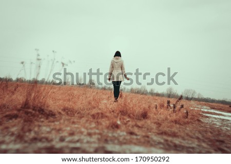 Similar – Image, Stock Photo Young, slim, tall woman with long, blond hair stands in a kitchen leaning against the cupboard and looks into the camera