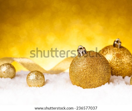 Golden christmas ball on glitter background. studio shot