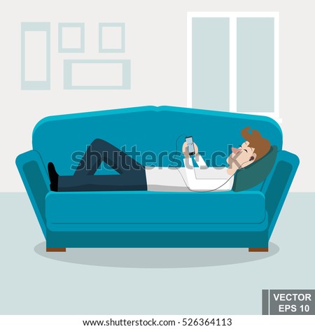Young man lying on the couch at home and listening to music. Smartphone. The flat design.