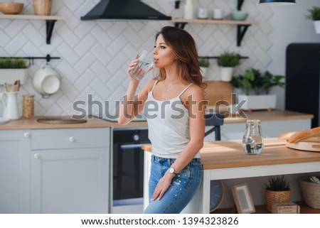 Similar – Image, Stock Photo Girl drinking from glass in the evening sun