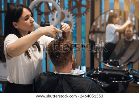 Similar – Image, Stock Photo Crop barber doing haircut for man