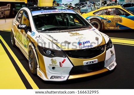 NONTHABURI - NOVEMBER 28: Honda Civic decoration and modify for racing by Sngha Team display on stage at The 30th Thailand International Motor Expo on November 28, 2013 in Nonthaburi, Thailand.