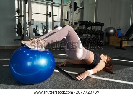 Similar – Image, Stock Photo Sportsman using pilates machine under supervision of female trainer