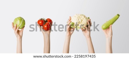 Image, Stock Photo Hand holding a cauliflower against a neutral background. Healthy food.