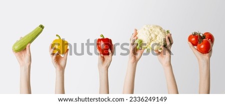 Similar – Image, Stock Photo Hand holding a cauliflower against a neutral background. Healthy food.